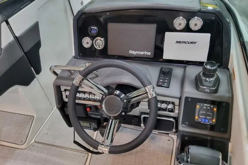 Slide: The Image of 2027 Formula 290 Bowrider dashboard with steering wheel, Raymarine display, and Mercury controls. - 21