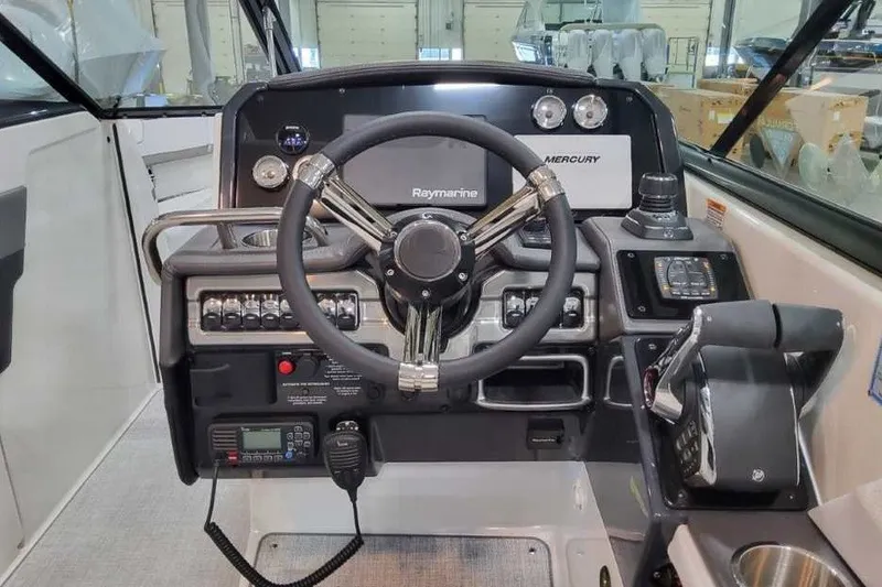 Slide: The Image of 2027 Formula 290 Bowrider helm with Raymarine and Mercury controls in a modern cockpit. - 20