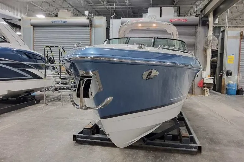 Slide: The Image of 2027 Formula 290 Bowrider boat in a showroom, front view. - 5