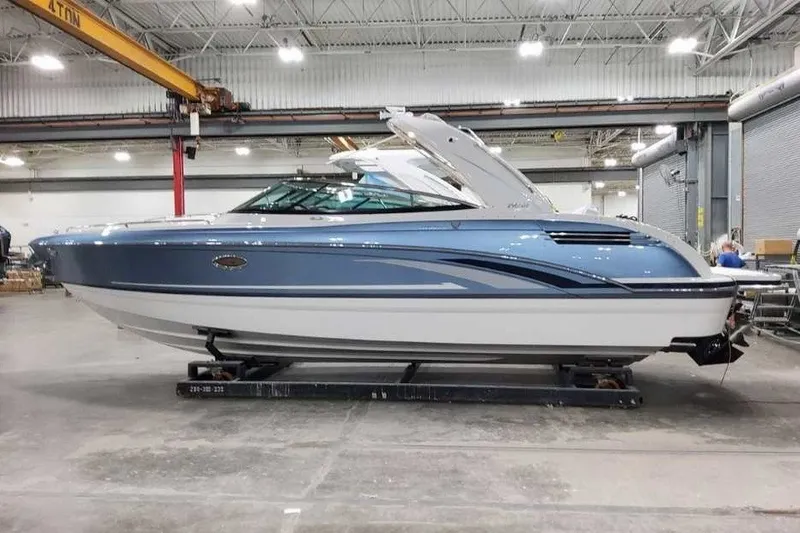 Slide: The Image of 2027 Formula 290 Bowrider boat in a warehouse, side view. - 1
