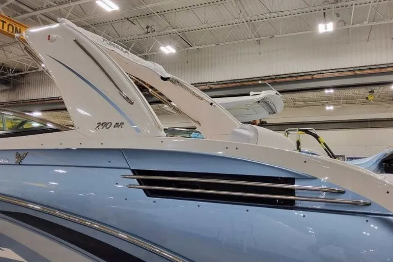 Slide: The Image of 2027 Formula 290 Bowrider boat in a showroom, showcasing sleek design and modern features. - 6