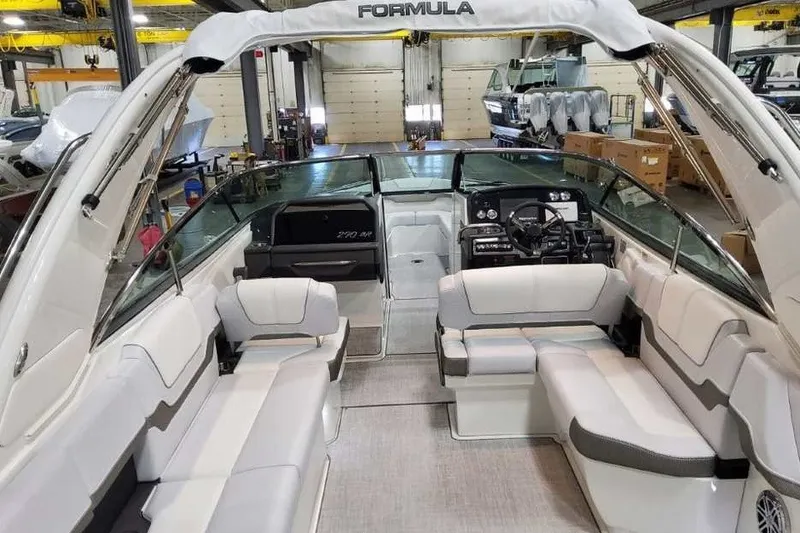 Slide: The Image of 2027 Formula 290 Bowrider boat interior with spacious seating and modern dashboard. - 12