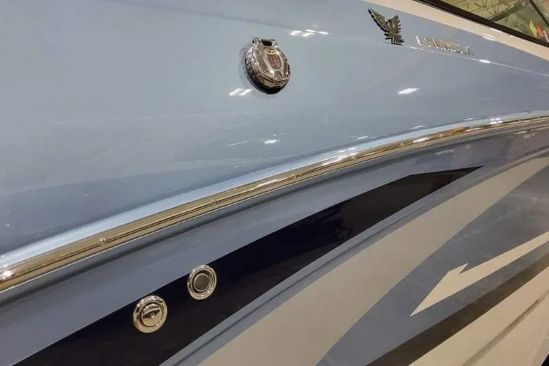 Slide: The Image of 2027 Formula 290 Bowrider boat side view with sleek design and emblem. - 4