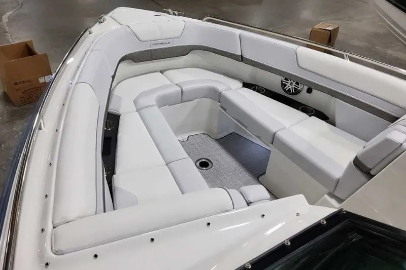 Slide: The Image of 2027 Formula 290 Bowrider boat interior with white seating and speaker system. - 27