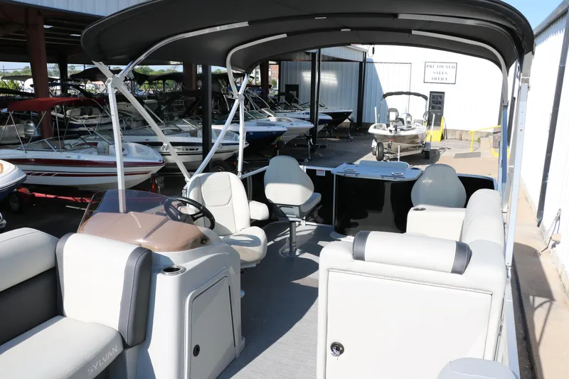 Slide: The Image of 2025 Sylvan Mirage 820 PARTY FISH pontoon boat interior with seating and helm. - 11