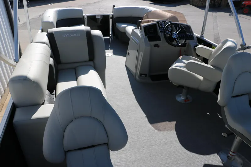 Slide: The Image of 2025 Sylvan Mirage 820 PARTY FISH pontoon boat interior with plush seating and steering console. - 14