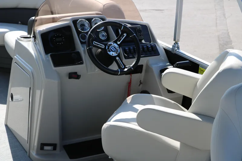 Slide: The Image of 2025 Sylvan Mirage 820 PARTY FISH boat interior with steering wheel and controls. - 15