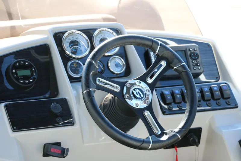 Slide: The Image of Steering console of 2025 Sylvan Mirage 820 PARTY FISH with gauges and controls. - 16