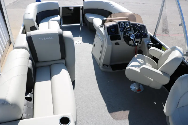 Slide: The Image of 2025 Sylvan Mirage 820 PARTY FISH pontoon boat interior with plush seating and modern helm. - 18