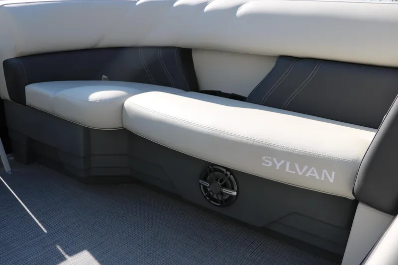 Slide: The Image of 2025 Sylvan Mirage 820 PARTY FISH boat interior with cushioned seating and speaker. - 21
