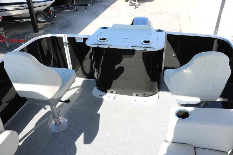 Slide: The Image of 2025 Sylvan Mirage 820 PARTY FISH boat interior with seating and table setup. - 22