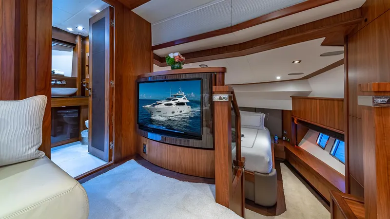 Slide: The Image of Luxurious interior of 2010 Sunseeker Flybridge yacht with wood paneling and modern amenities. - 10