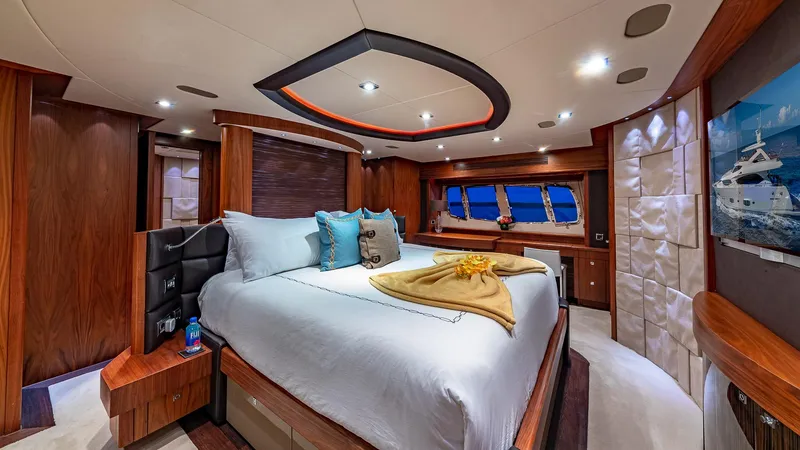 Slide: The Image of Luxurious Sunseeker Flybridge 2010 yacht bedroom with elegant wood finishes and modern lighting. - 12