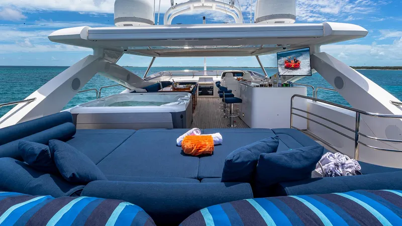 Slide: The Image of Luxurious 2010 Sunseeker Flybridge yacht with spacious deck, jacuzzi, and ocean view. - 21