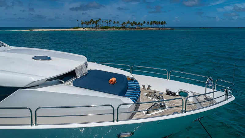 Slide: The Image of Sunseeker Flybridge 2010 yacht anchored near tropical island, clear blue ocean, sunny day. - 23