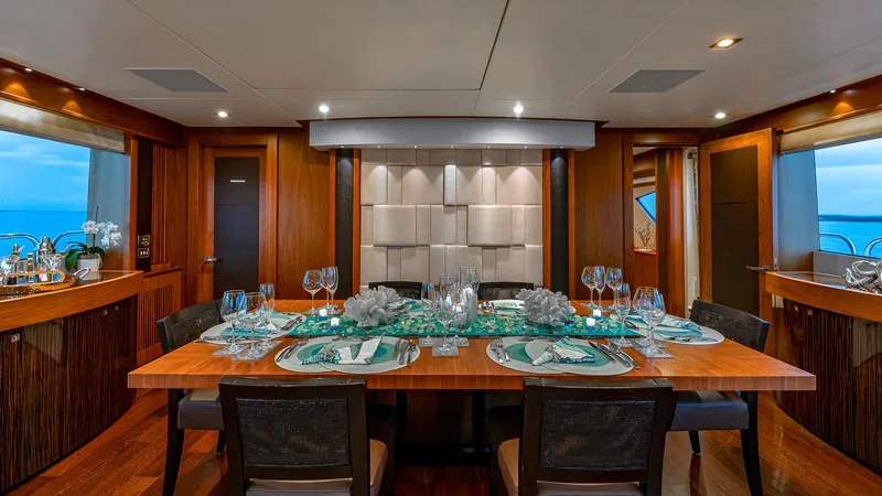 Slide: The Image of Luxurious dining area on 2010 Sunseeker Flybridge yacht, featuring elegant table settings and modern decor. - 6