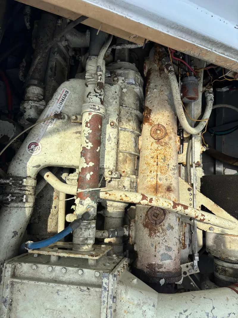 Slide: The Image of Rusty engine components of a 1974 Striker Canyon Runner boat. - 25