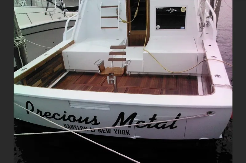 Slide: The Image of 1974 Striker Canyon Runner boat named "Precious Metal" docked in Babylon, New York. - 28
