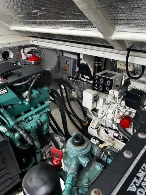 Slide: The Image of Engine room of a 2005 Carolina Classic 28 Express boat, showcasing mechanical components. - 8