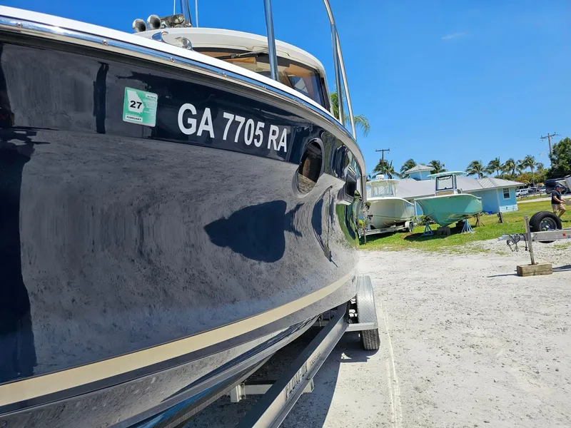 Slide: The Image of 2019 Ranger Tugs 23R boat on trailer, sunny day, clear blue sky. - 9
