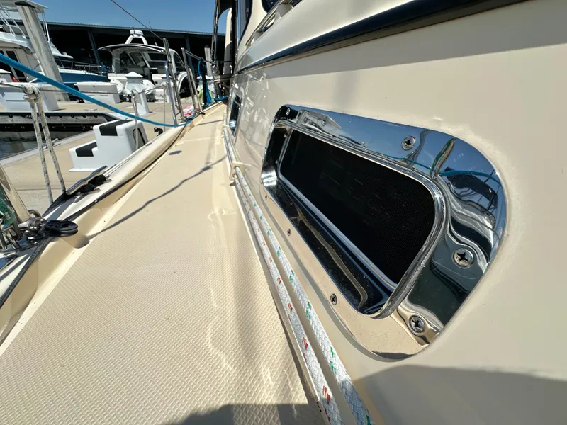 Slide: The Image of 2021 Island Packet 349 yacht deck with chrome details at marina. - 17