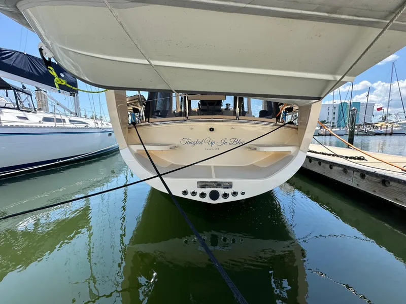 Slide: The Image of 2021 Island Packet 349 sailboat docked at marina, rear view. - 2