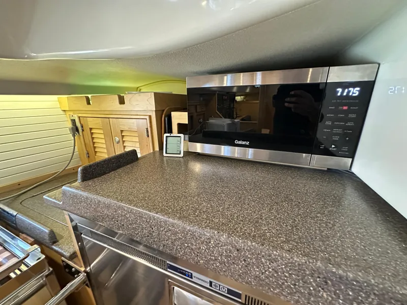 Slide: The Image of Modern galley kitchen in 2021 Island Packet 349 yacht with Galanz microwave. - 32