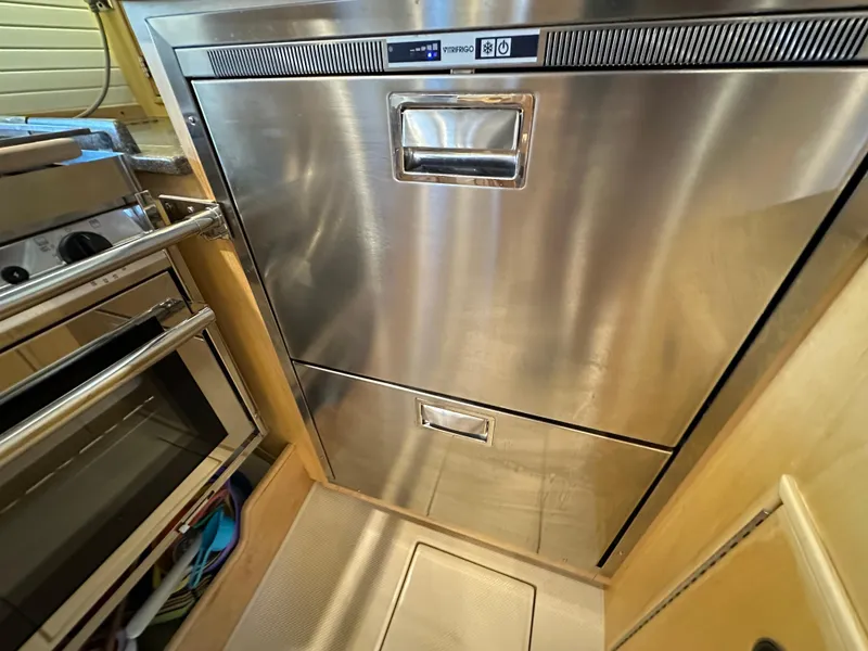 Slide: The Image of Stainless steel kitchen appliances in 2021 Island Packet 349 yacht galley. - 33