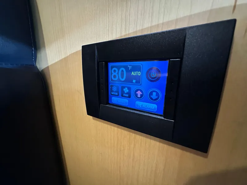 Slide: The Image of Digital control panel on 2021 Island Packet 349 yacht, displaying temperature settings. - 37