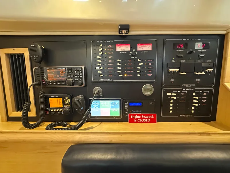 Slide: The Image of Electrical control panel of a 2021 Island Packet 349 sailboat with communication devices. - 38