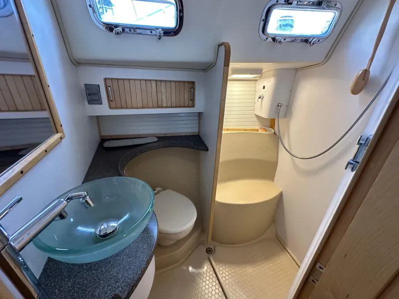 Slide: The Image of Modern bathroom in 2021 Island Packet 349 yacht with glass sink and shower. - 43