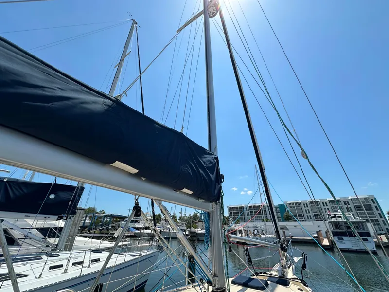 Slide: The Image of Sailboat Island Packet 349, 2021 model, docked under clear blue sky. - 7