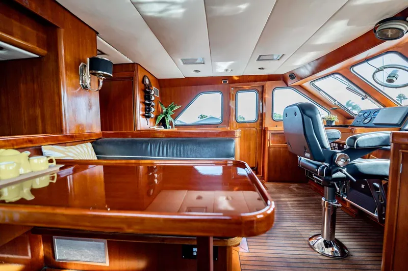 Slide: The Image of Luxurious 1985 Lowland 68 Neth Ships yacht interior with polished wood and leather seating. - 12