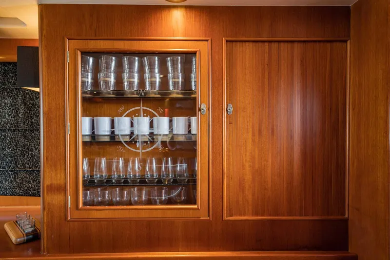 Slide: The Image of Wooden cabinet with glassware on a 1985 Lowland 68 Neth Ships yacht. - 16