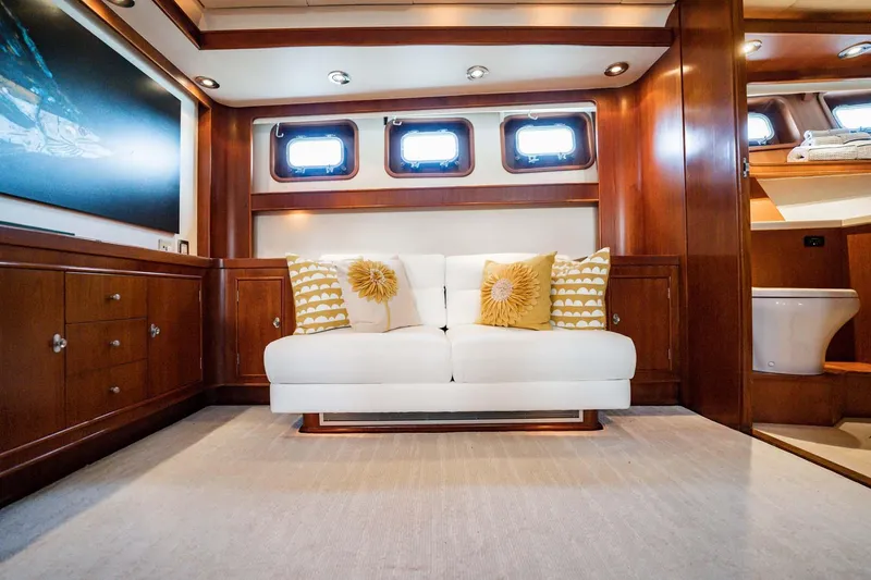 Slide: The Image of Luxurious yacht interior with white sofa, wooden cabinetry, and decorative pillows, Lowland 68 Neth Ships 1985. - 20
