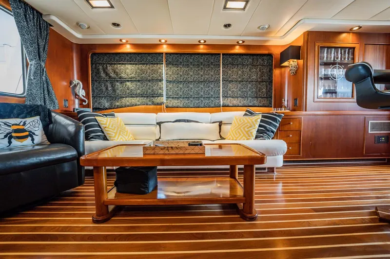 Slide: The Image of Luxurious yacht interior with wooden flooring, elegant seating, and decorative accents, Lowland 68 Neth Ships, 1985. - 3