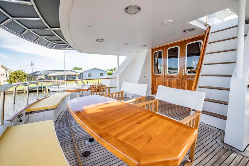 Slide: The Image of Outdoor deck of 1985 Lowland 68 Neth Ships yacht with wooden furniture and stairs. - 33
