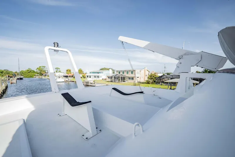 Slide: The Image of 1985 Lowland 68 Neth Ships yacht deck with scenic waterfront view. - 37