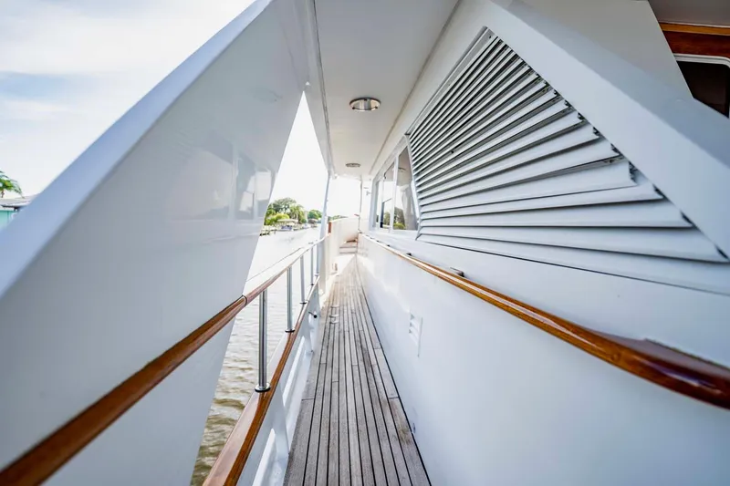 Slide: The Image of Side deck of 1985 Lowland 68 Neth Ships yacht with wooden railings and sleek design. - 38