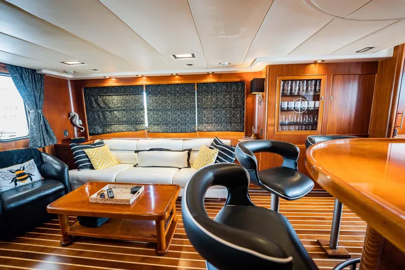 Slide: The Image of Luxurious yacht interior with modern seating, wooden accents, and elegant decor, 1985 Lowland 68 Neth Ships. - 4
