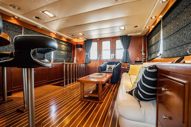 Slide: The Image of Luxurious interior of 1985 Lowland 68 Neth Ships yacht with elegant wood finishes and modern seating. - 5