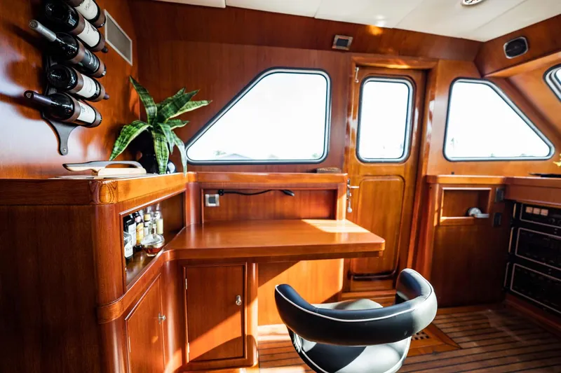 Slide: The Image of Luxurious wooden interior of 1985 Lowland 68 Neth Ships yacht with bar and seating. - 6