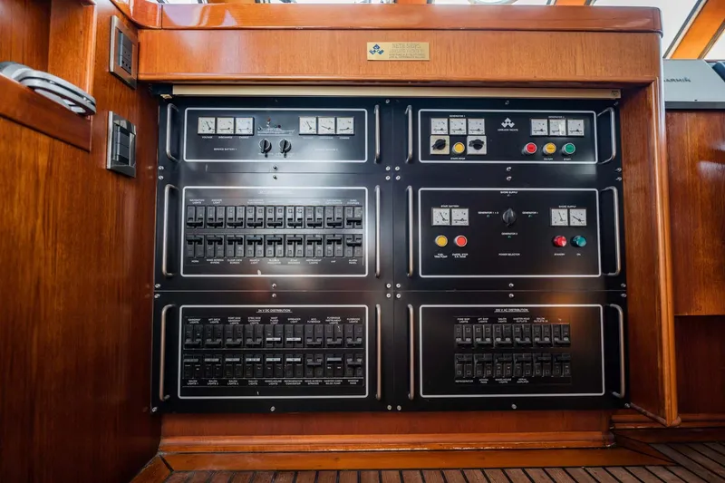 Slide: The Image of Electrical control panel on a 1985 Lowland 68 Neth Ships yacht, featuring switches and gauges. - 8