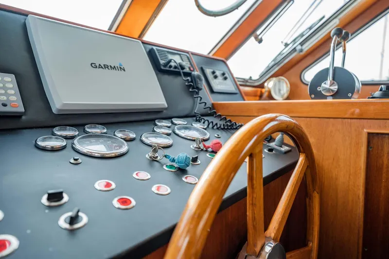Slide: The Image of Control panel of 1985 Lowland 68 Neth Ships with wooden steering wheel and navigation instruments. - 9