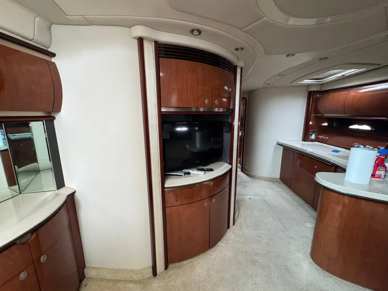 Slide: The Image of Interior of 2003 Sea Ray 500 Sundancer yacht with wood cabinetry and modern amenities. - 14