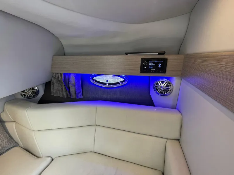 Slide: The Image of 2023 Formula 330 Crossover Bowrider OB interior with modern seating and ambient lighting. - 17