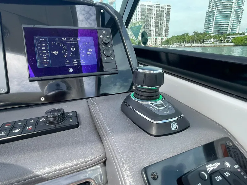 Slide: The Image of 2023 Formula 330 Crossover Bowrider OB dashboard with advanced controls and navigation display. - 22