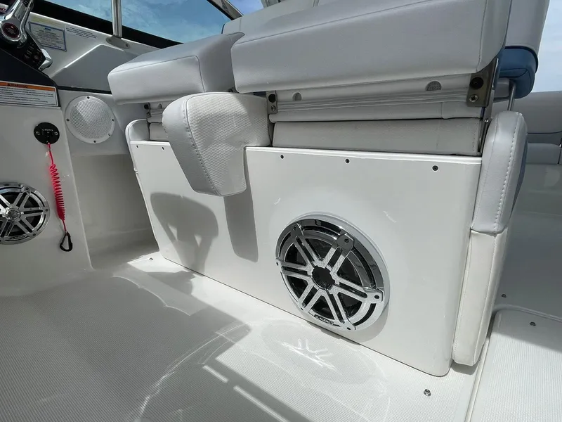 Slide: The Image of 2023 Formula 330 Crossover Bowrider OB interior with speaker and seating detail. - 26