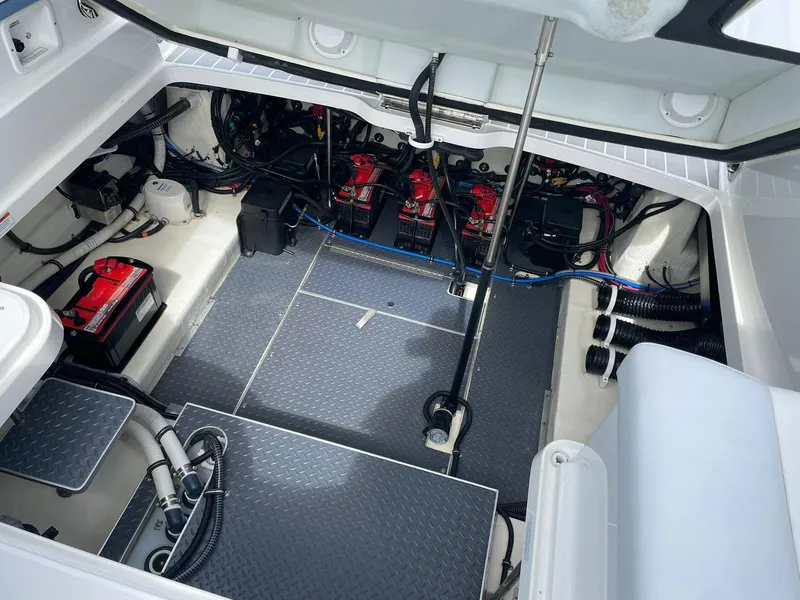 Slide: The Image of 2023 Formula 330 Crossover Bowrider OB engine compartment with batteries and wiring. - 40