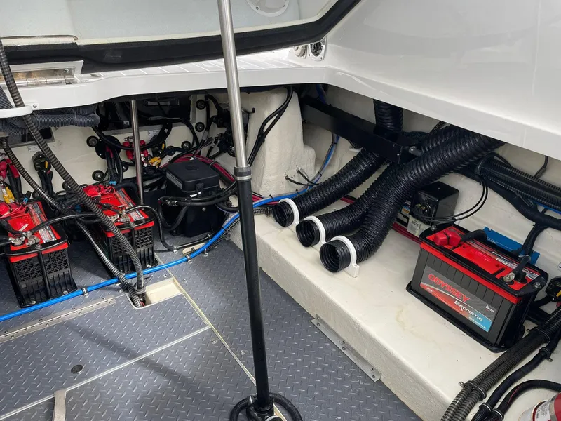 Slide: The Image of Engine compartment of 2023 Formula 330 Crossover Bowrider OB with batteries and wiring. - 43